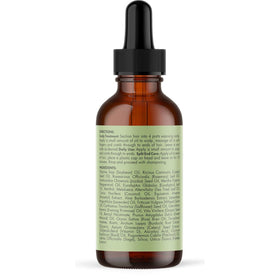 Mielle Organics 2 ounce bottle next to coin showing compact travel-friendly size