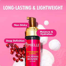 Product size comparison in hand showing Mielle Organics travel-friendly bottle