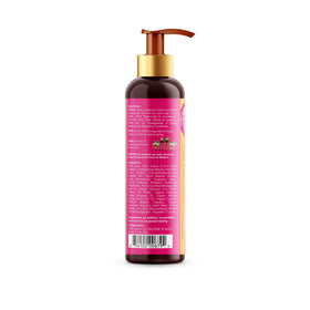 Mielle Organics 12 fl oz bottle beside hand to show true size and portability