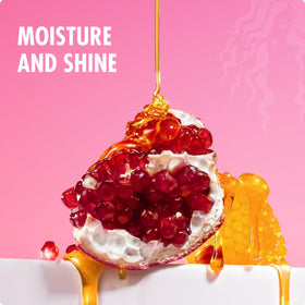 Mielle Organics lifestyle image of curly-haired person using conditioner for manageability