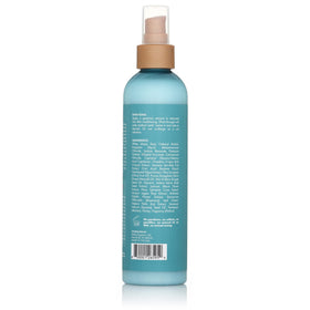 Mielle Organics bottle on bathroom shelf suggesting daily styling convenience