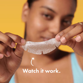Mighty Patch chin held in hand demonstrating XL size for better blemish coverage