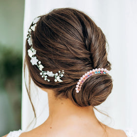 MIKIMIQI hair fork clip inserted into a bun demonstrating secure hold during wear