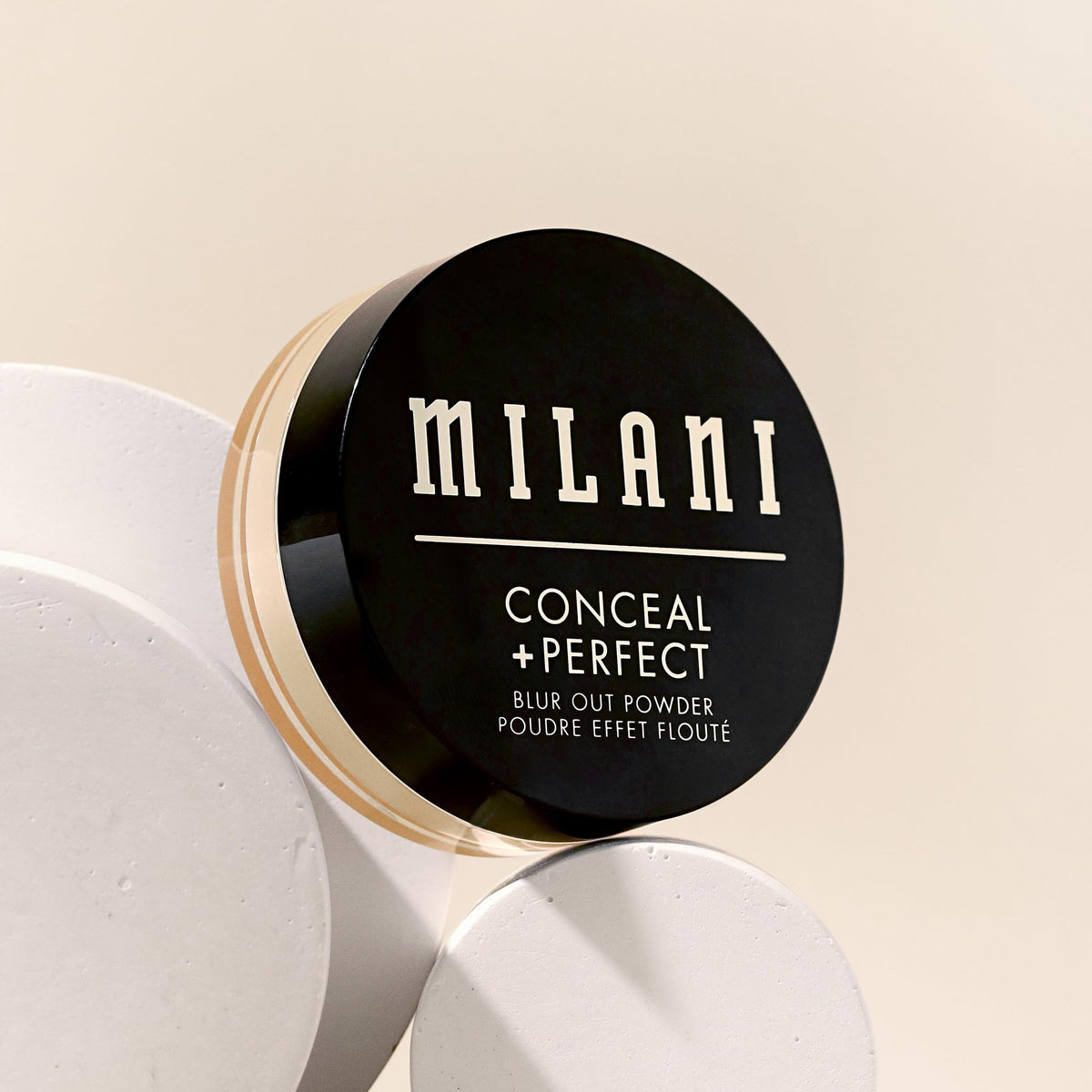 Milani powder being applied with brush for long-lasting blurred finish