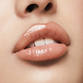 Milani over lipstick demo showing how Champagne adds reflective dimension