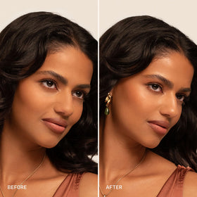 Milani in use as model mists face to refresh makeup and boost radiance