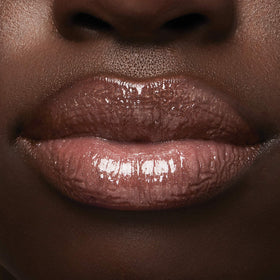 Milani label and shade name close-up showing Prismatic Peach identification benefit