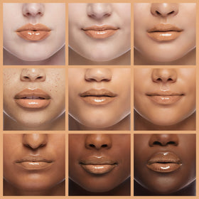 Milani lip swatch of Gold Dust illustrating sheer gold shimmer and fuller look