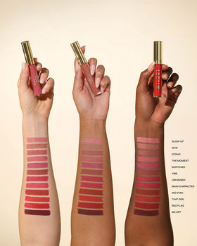 Milani swatch of Red Flag on forearm showing true pigment payoff
