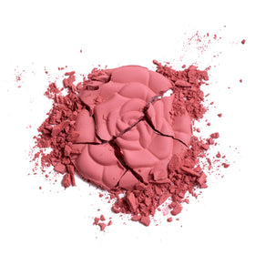 Milani label close-up showing brand commitment and shade information benefit