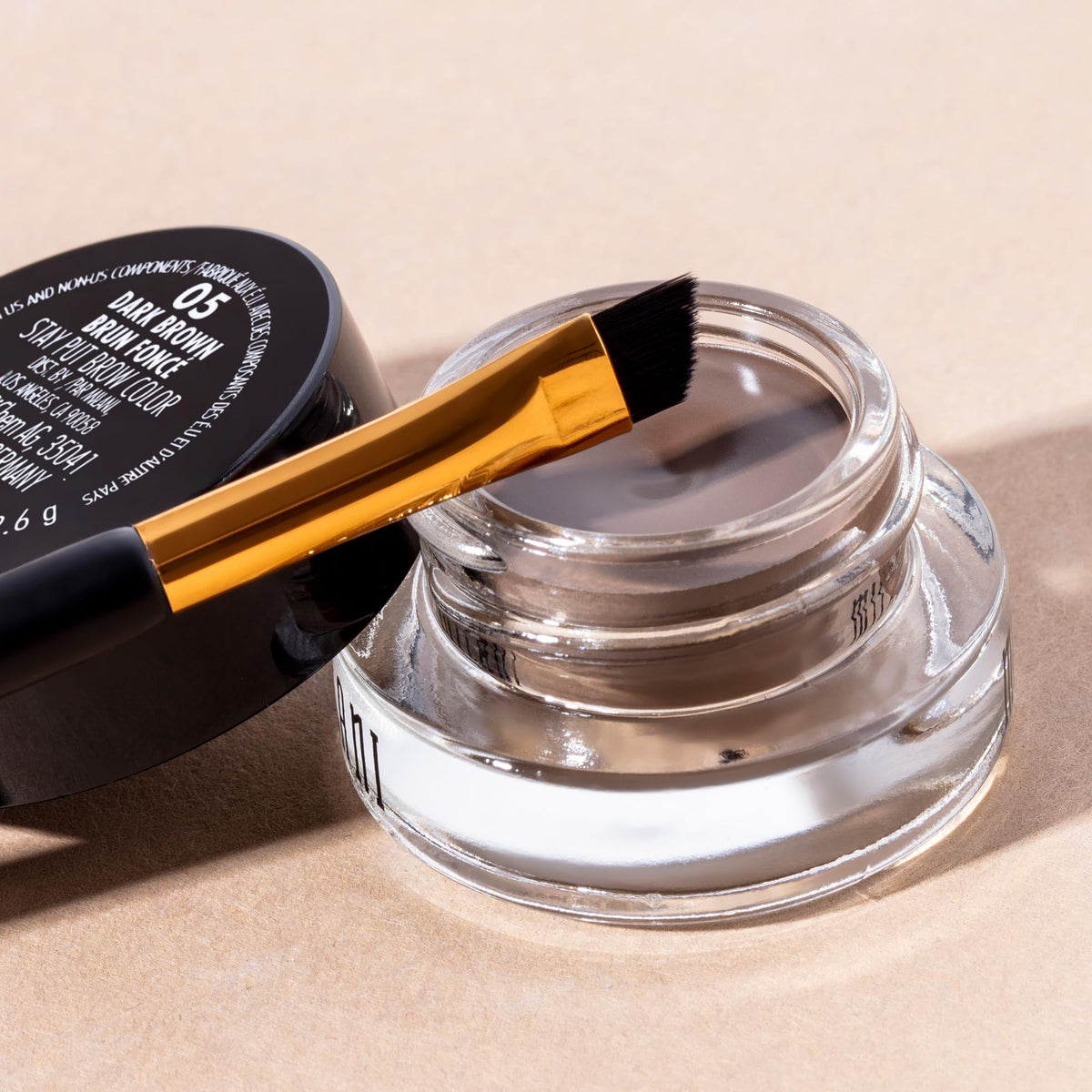 milani size comparison next to coin showing travel-friendly convenience