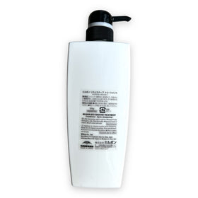 Milbon bottle in bathroom lifestyle scene showing easy at-home repair and manageability