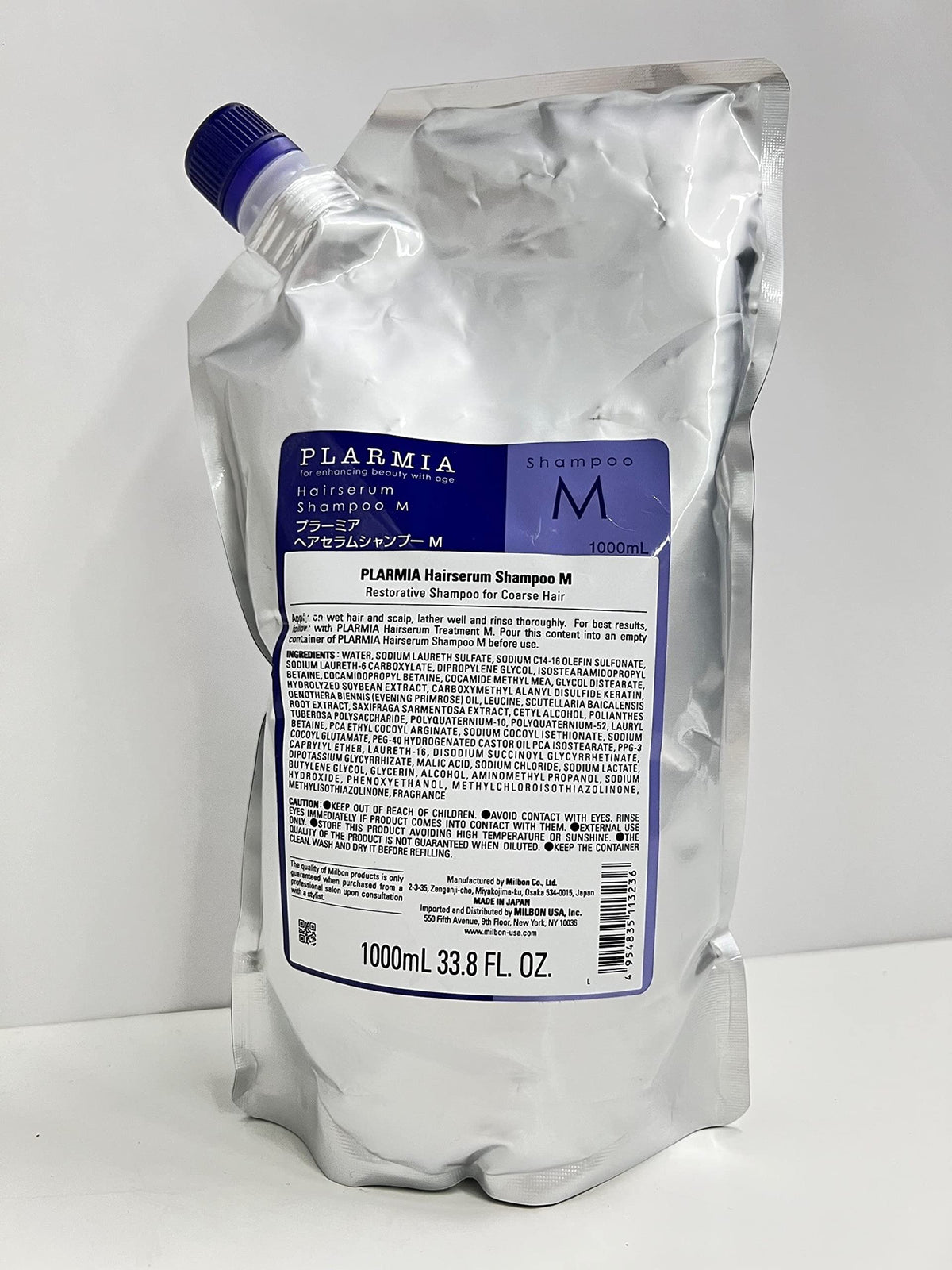 Milbon bottle front packaging showing label and large 33.8 oz size for long-lasting use