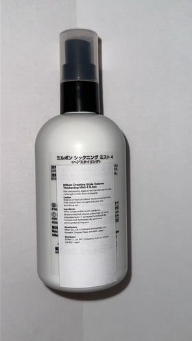 Milbon spray in use applying fine mist for instant volume and styling control