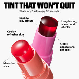 Model applying Milk Makeup tint to lips for buildable pigment benefit