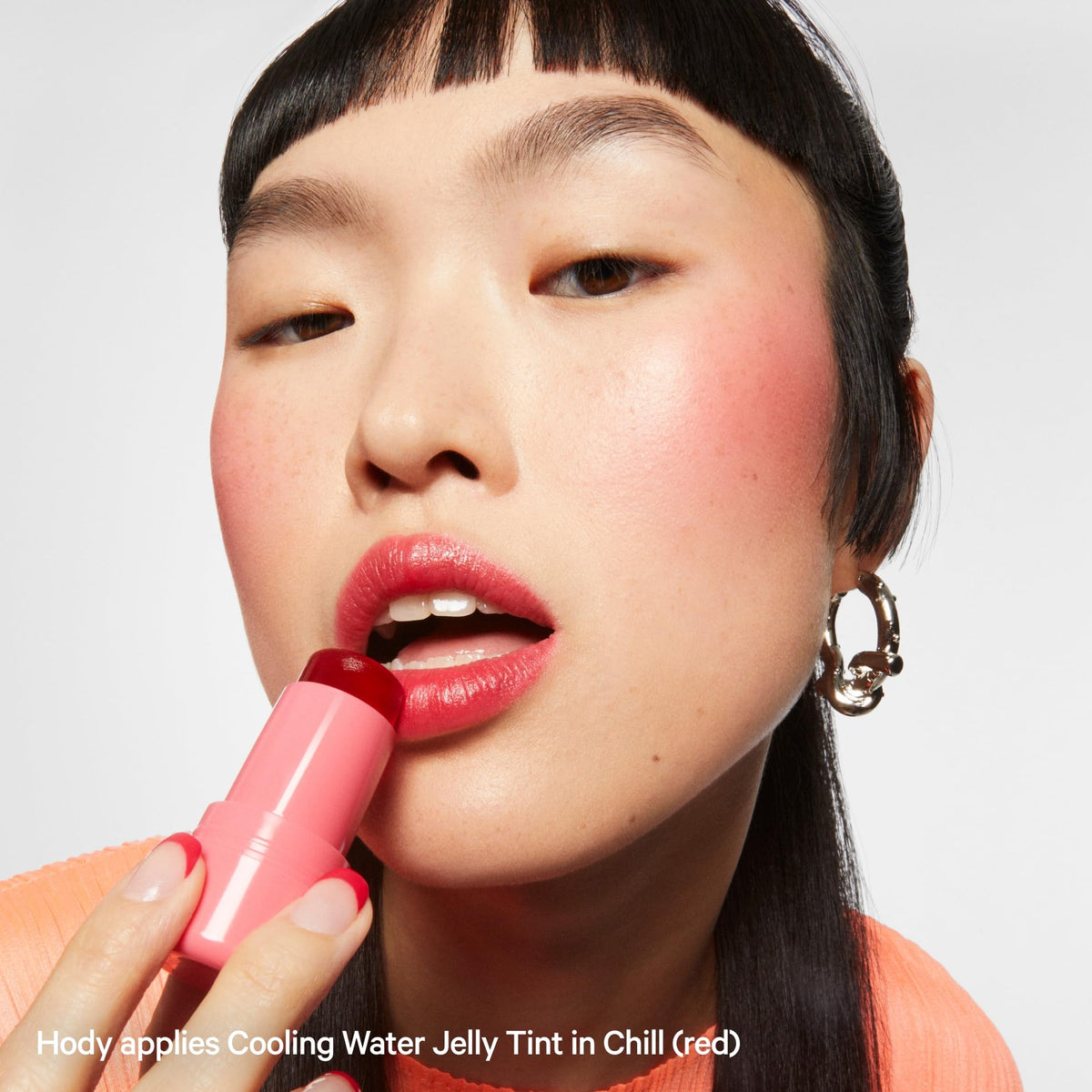 Milk Makeup model in street setting showing wearable, long-lasting color