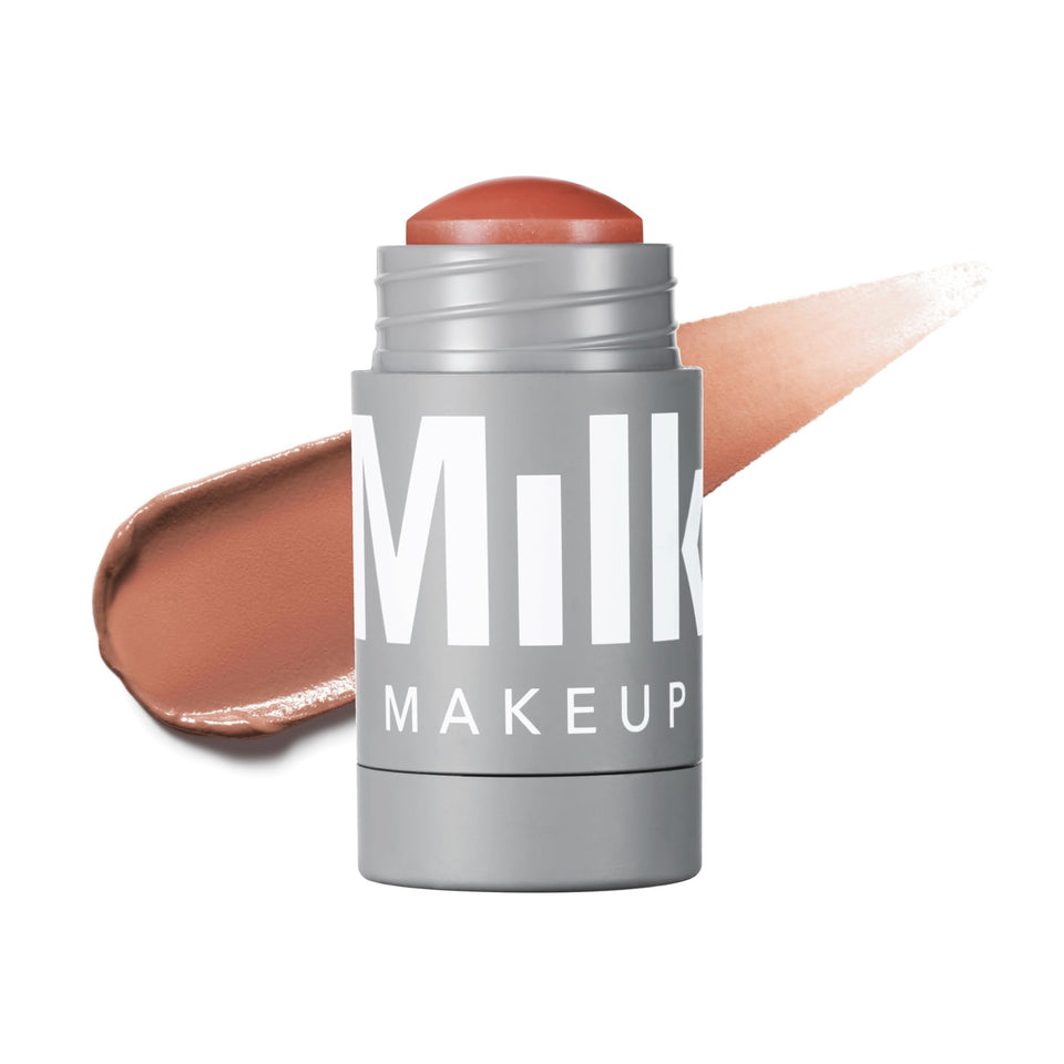 Milk Makeup Enigma front view of the twist-up lip and cheek stick showing compact design and color