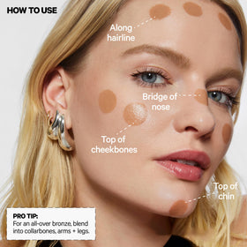 Milk Makeup bronzer blended on collarbone for all-over sun-kissed body glow