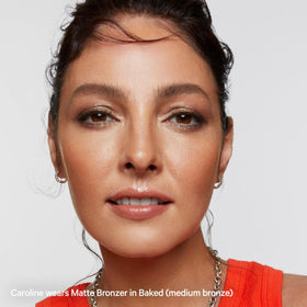 Milk Makeup bronzer blended on collarbone showing even all-over body bronze