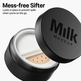 Milk Makeup powder applied with brush to set makeup for long wear benefit