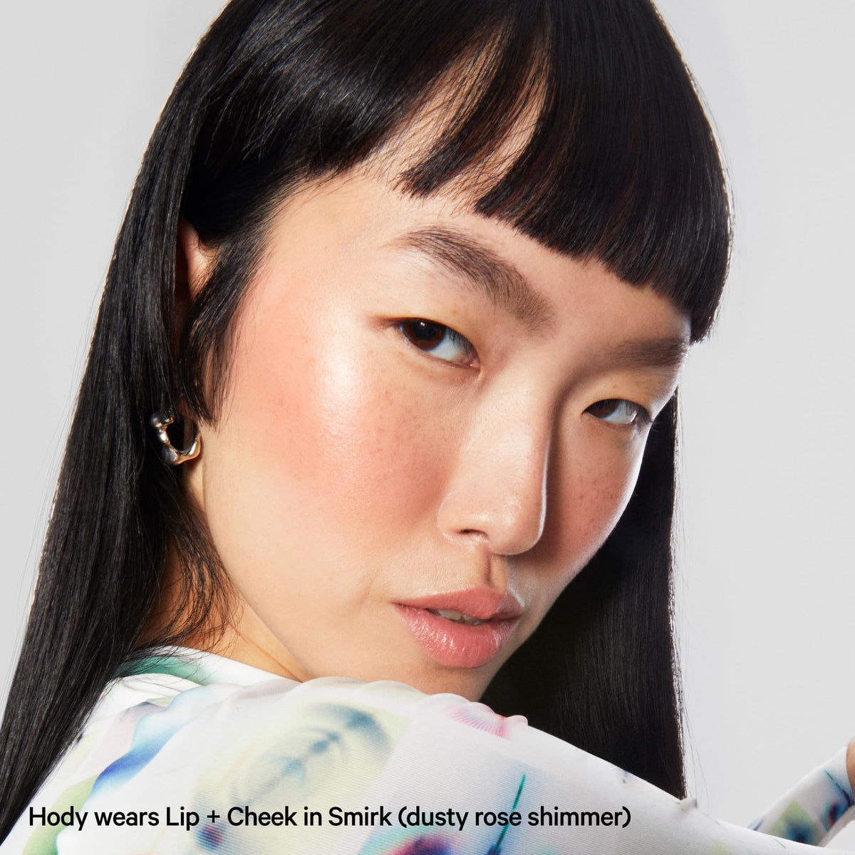 Milk Makeup next to common items showing size comparison and travel-ready benefit