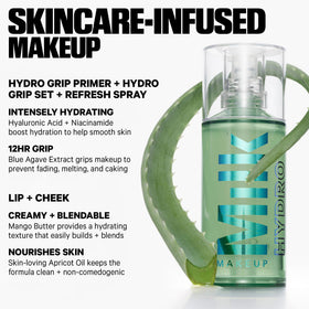 Milk Makeup setting spray held next to hand for size reference and travel-friendly benefit
