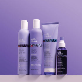 milk_shake blonde lifestyle shot of model using product for maintained cool-toned hair
