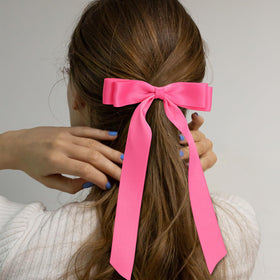Mimorou bow held in hand for scale showing true size and tail length