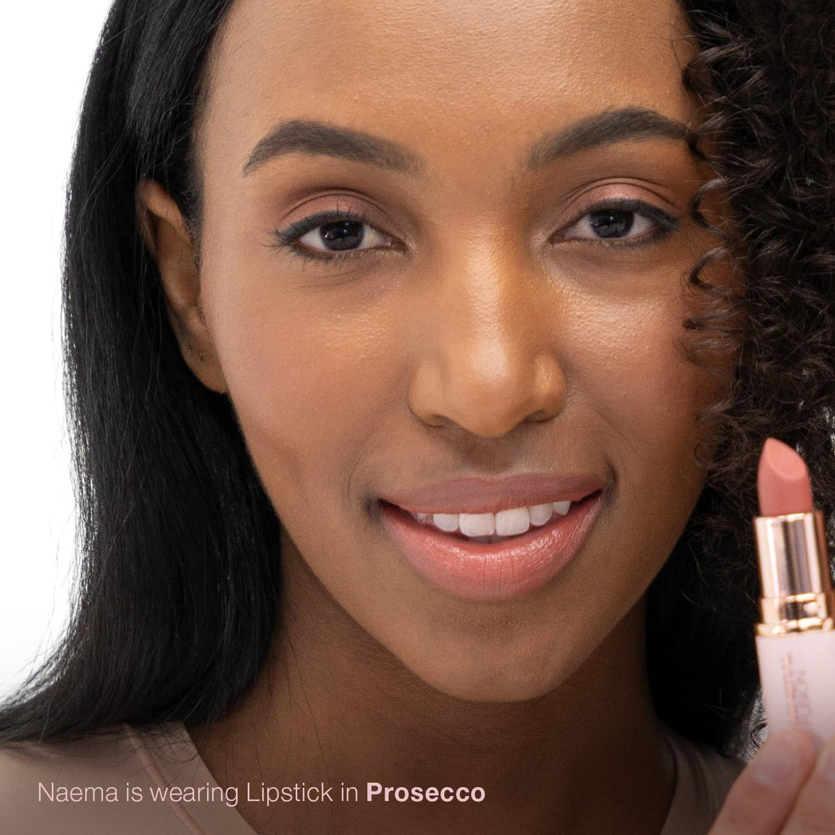 Mineral Fusion lipstick cap off revealing bullet and smooth tip for precise application