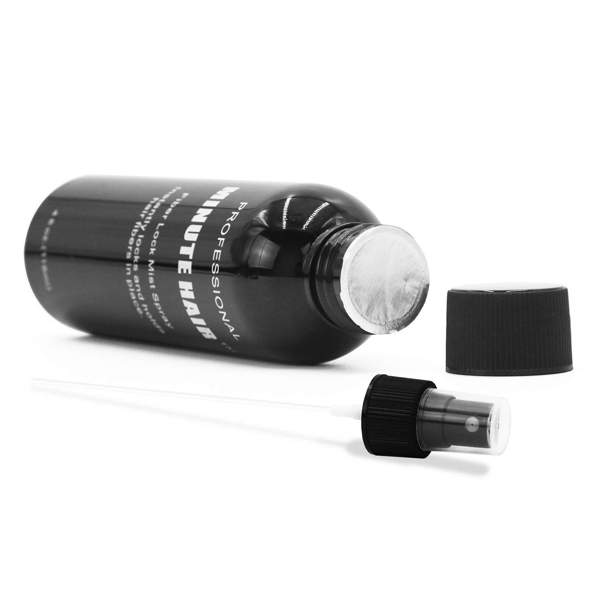 Minute Hair bottle next to ruler to show compact travel-friendly size