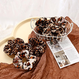 Mirlern scrunchie held in hand to show large size and reliable stretch