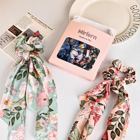 mirlern scrunchie tied in pony demonstrating a polished bow finish and hold