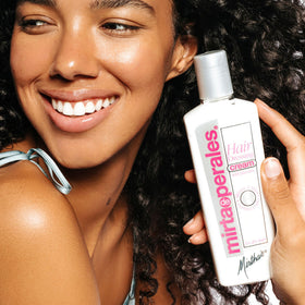 Mirta De Perales being applied to damp hair to improve manageability and shine