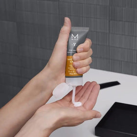 MITCH next to a ruler showing 2.5 fl oz size, helps understand product scale