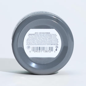 MITCH pomade next to ruler showing compact 3 oz travel-friendly size