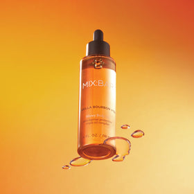 MIX:BAR bottle pouring oil from dropper highlighting silky texture