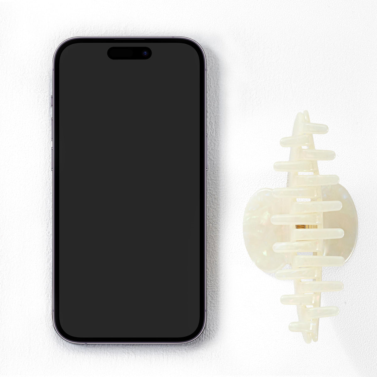 Mixcbe in-use image holding a bun for secure, stylish updo benefit