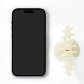 Mixcbe in-use image holding a bun for secure, stylish updo benefit