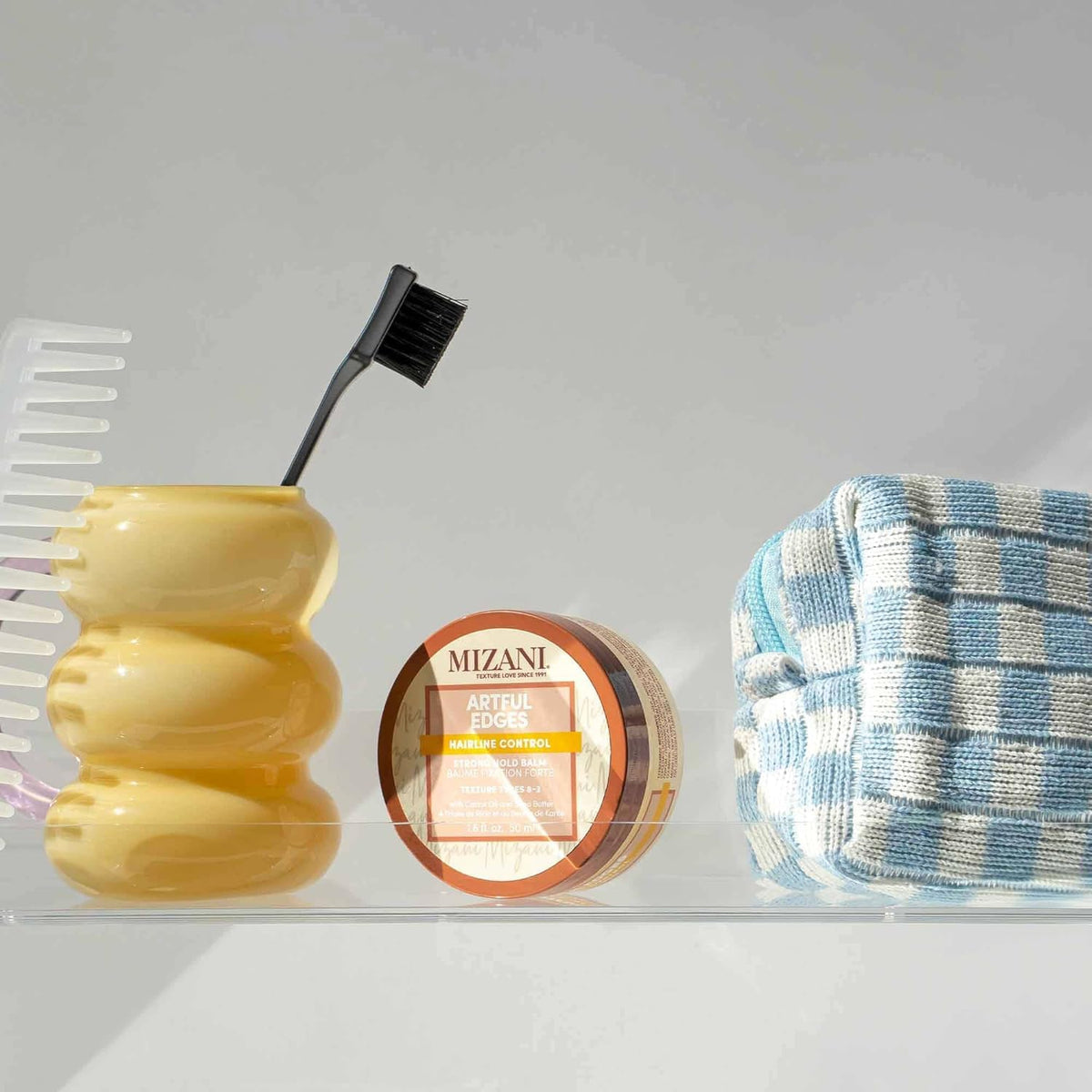 Mizani size comparison next to hand showing jar portability benefit