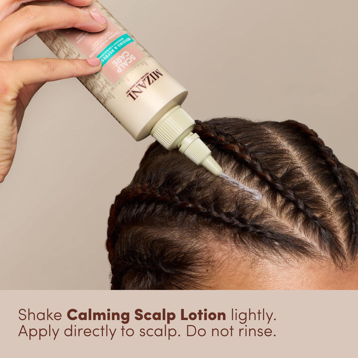 Mizani lotion texture on hand emphasizing lightweight, non-greasy hydration