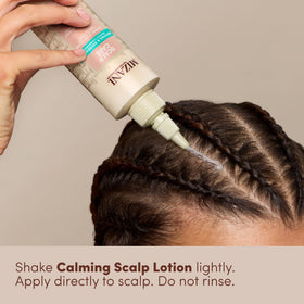 Mizani lotion texture on hand emphasizing lightweight, non-greasy hydration
