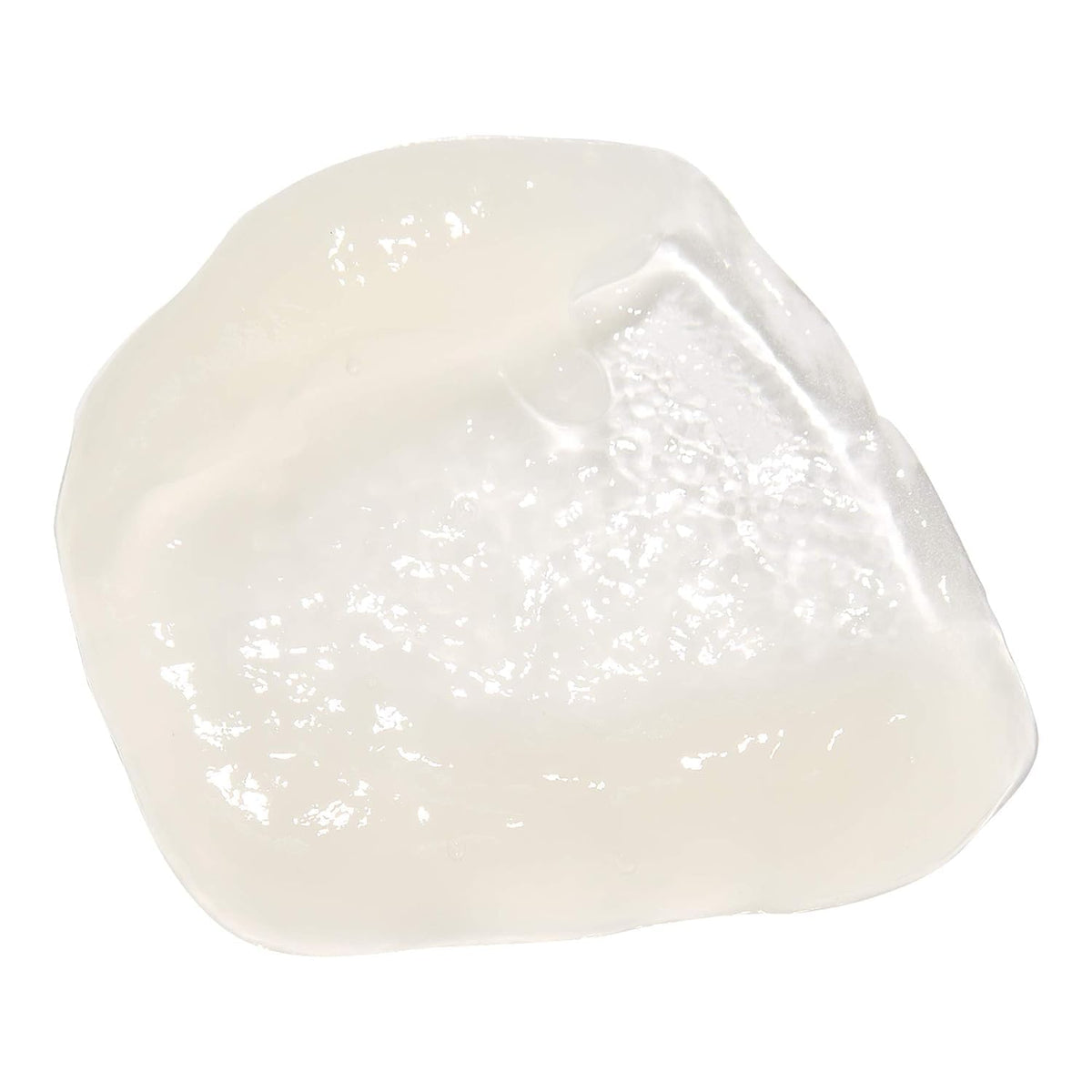Mizani jar held in hand to show size and travel-friendly convenience