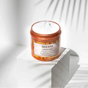 Mizani Strength Fusion applied to curly hair overnight protecting against breakage