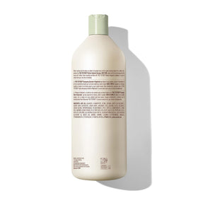 Mizani shampoo in salon setting used by stylist for textured hair