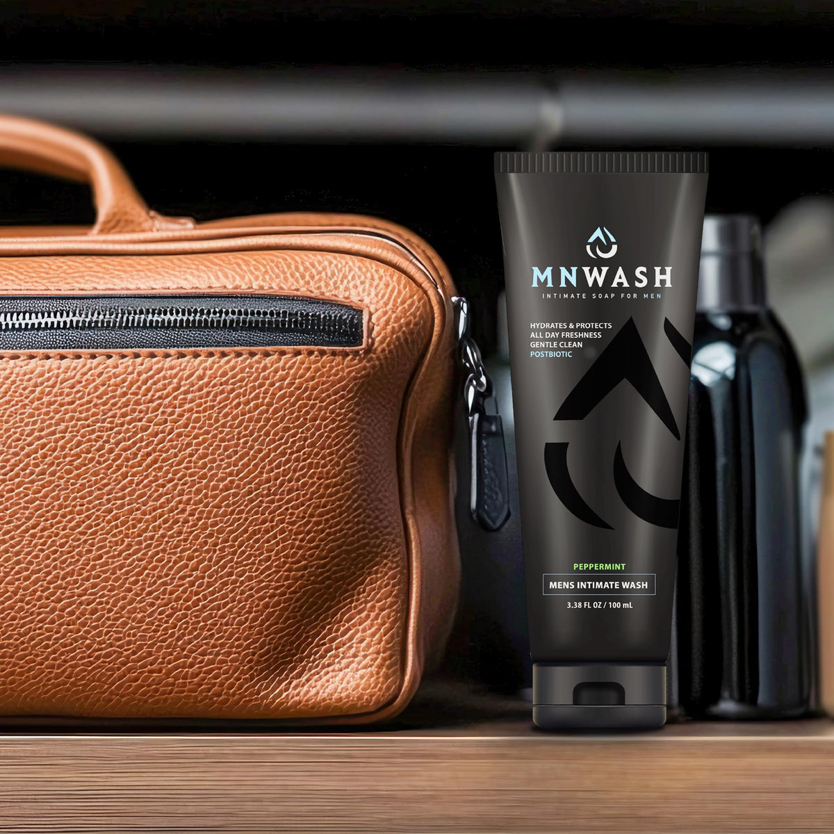 MNWASH bottle packed in toiletry kit emphasizing travel-ready intimate care