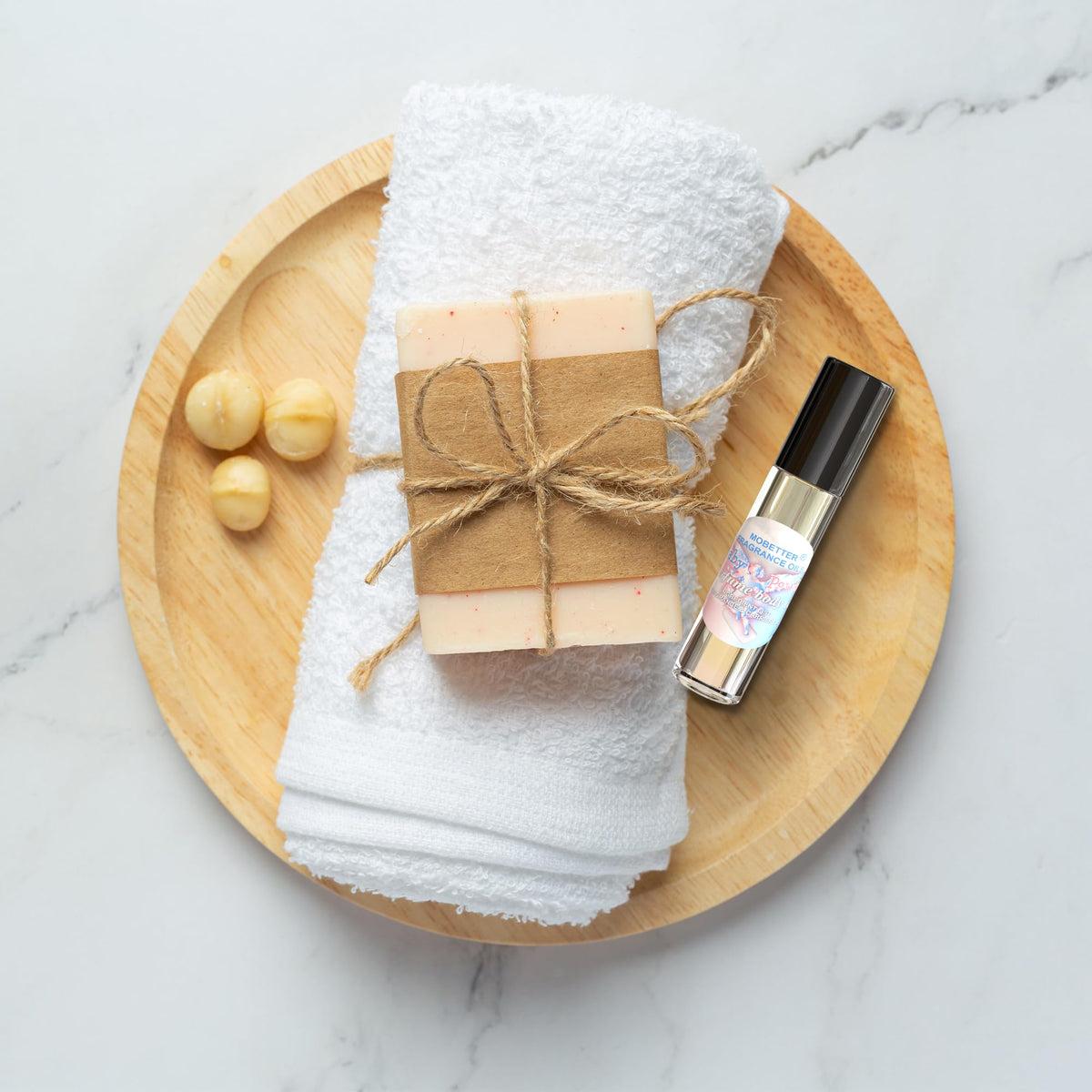 MOBETTER FRAGRANCE OILS applying roll-on to wrist for long-lasting scent