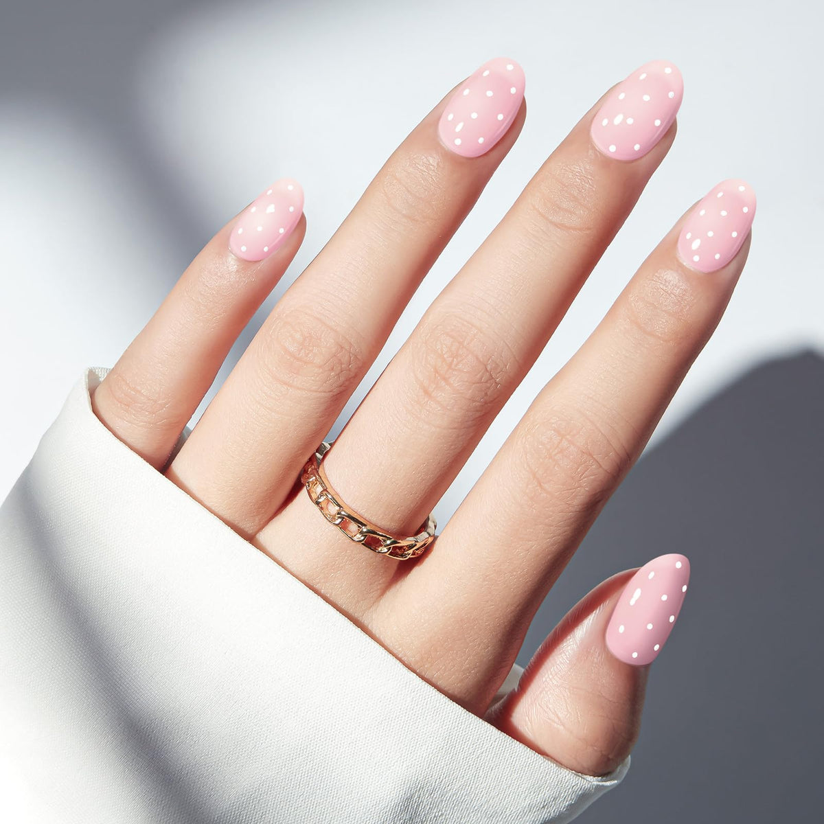 modelones close-up of semi-transparent pink polka dots highlighting glossy finish