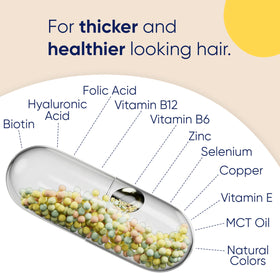 Moerie bottle on vanity with hairbrush, suggests daily beauty routine