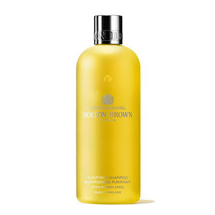 Molton Brown bottle front view showing Indian Cress label and elegant design benefit: premium presentation