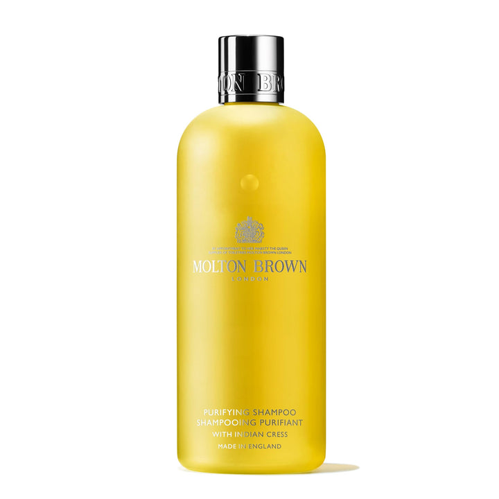 Molton Brown bottle front view showing Indian Cress label and elegant design benefit: premium presentation